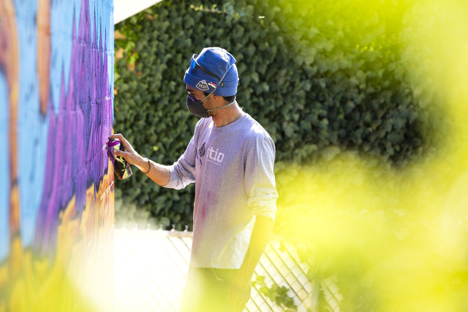 Working on a mural in progress