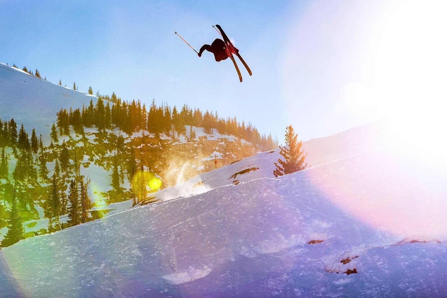 Backlit air off a wind lip at sunset
